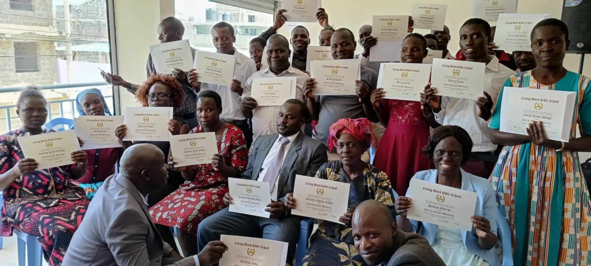 Living Word Bible School students celebrating graduation in Kenya